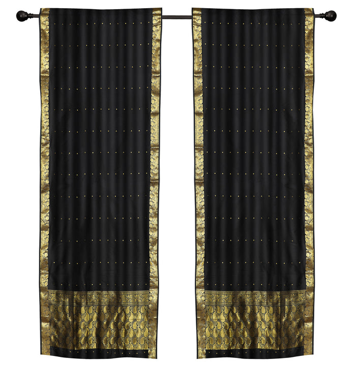 Black sari rod pocket curtains hung at a window