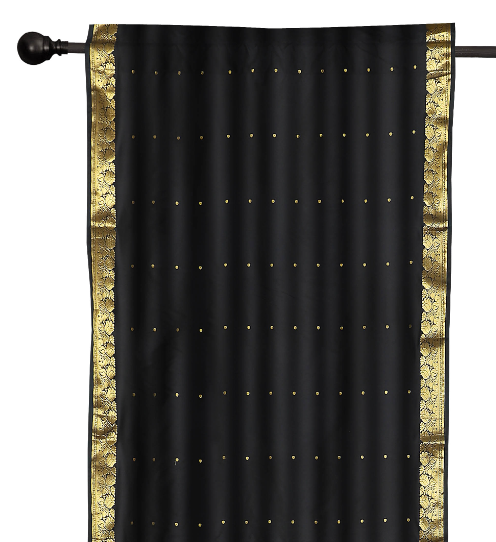Black sari rod pocket curtains hung at a window