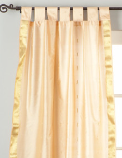 Misty rose sari tab top curtains hung at a window