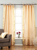 Misty rose sari tie top curtains hung at a window