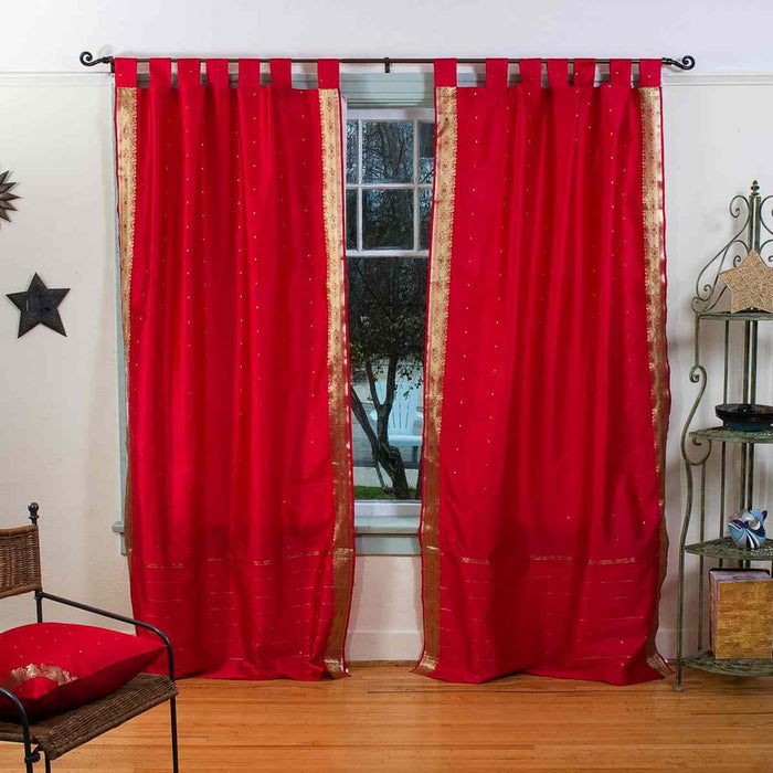 Fire brick sari tab top curtains hung at a window