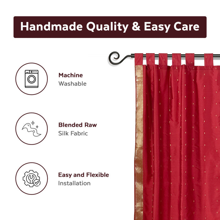 Fire brick sari tab top curtains hung at a window