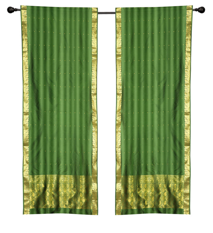 Green sari rod pocket curtains hung at a window