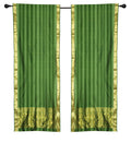 Green sari rod pocket curtains hung at a window