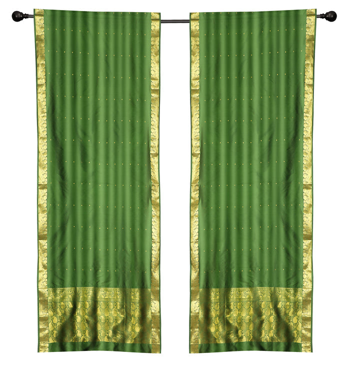 Green sari rod pocket curtains hung at a window