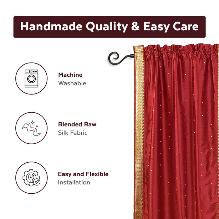 Maroon sari rod pocket curtains hung at a window