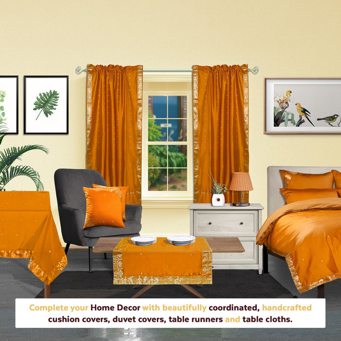 Mustard sari rod pocket curtains hung at a window