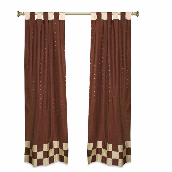 Brown sari tab top curtains hung at a window