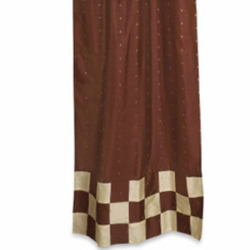 Brown sari tab top curtains hung at a window