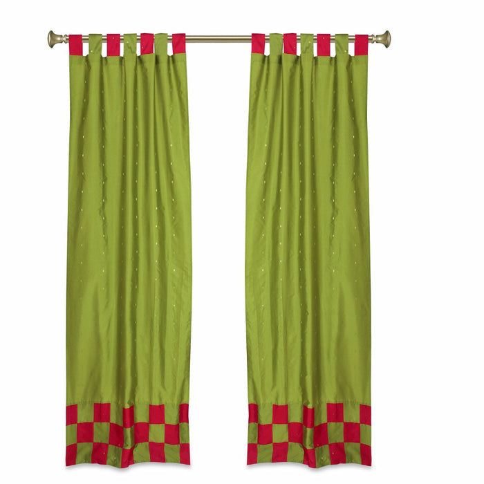 Olive green sari tab top curtains hung at a window
