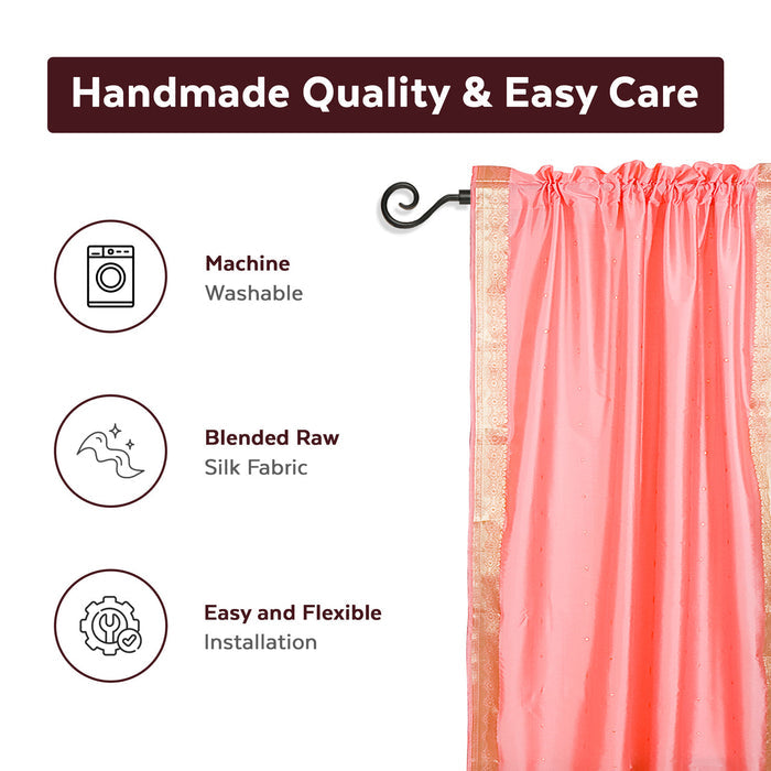 Pink sari rod pocket curtains hung at a window