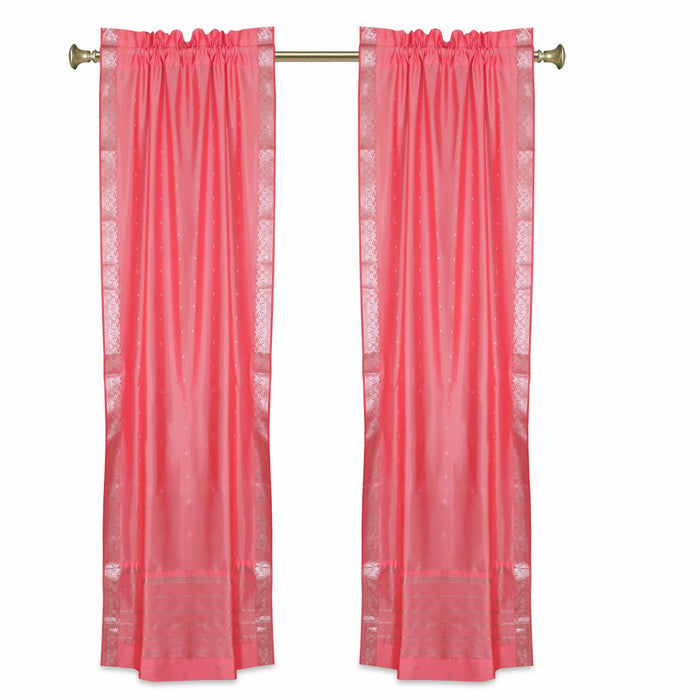 Silver sari rod pocket curtains hung at a window