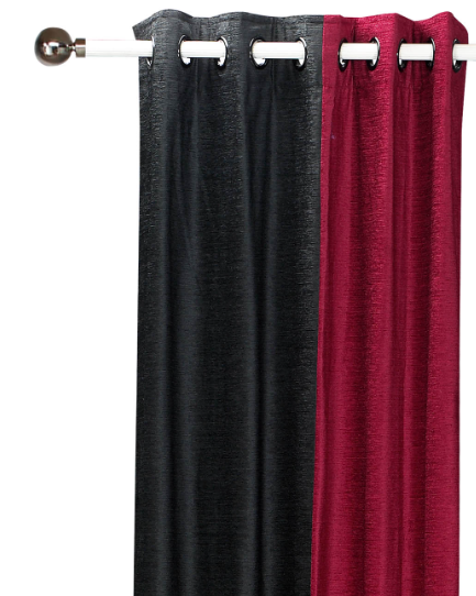 Burgundy velvet ring top curtains hung at a window