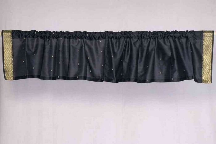Black sari valance mounted above a window