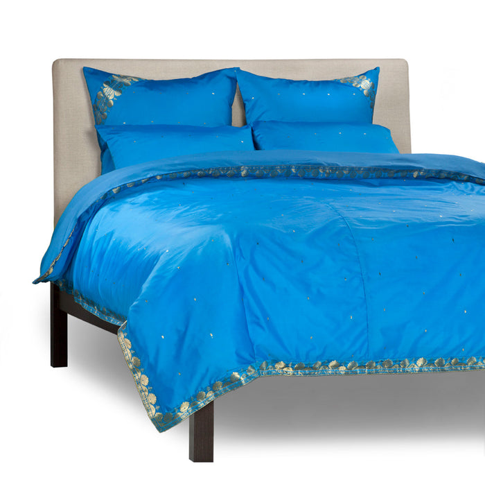 Blue sari duvet cover set made up on a bed