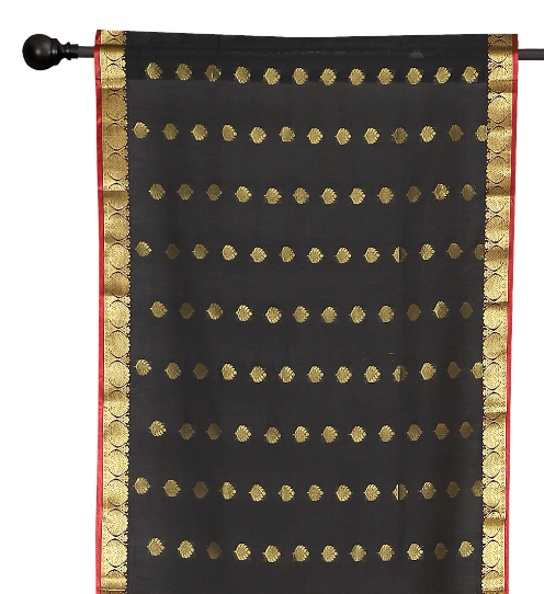 Black sari rod pocket curtains hung at a window