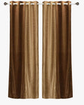 Taupe velvet ring top curtains hung at a window