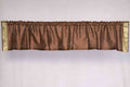 Brown sari valance mounted above a window