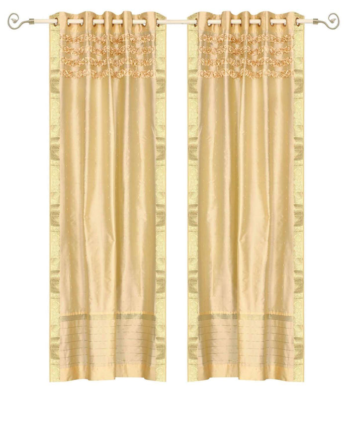 Golden sari grommet top curtains hung at a window