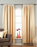 Golden sari tab top curtains hung at a window
