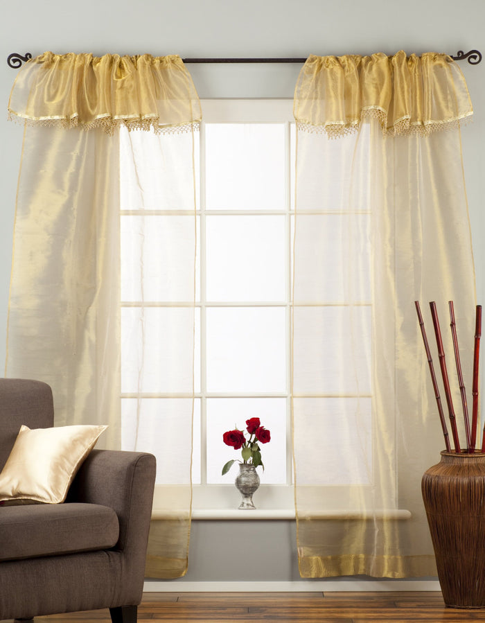 Golden rod sheer tissue rod pocket curtains hung at a window