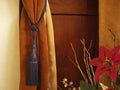 Gray sari curtain tiebacks holding a panel open