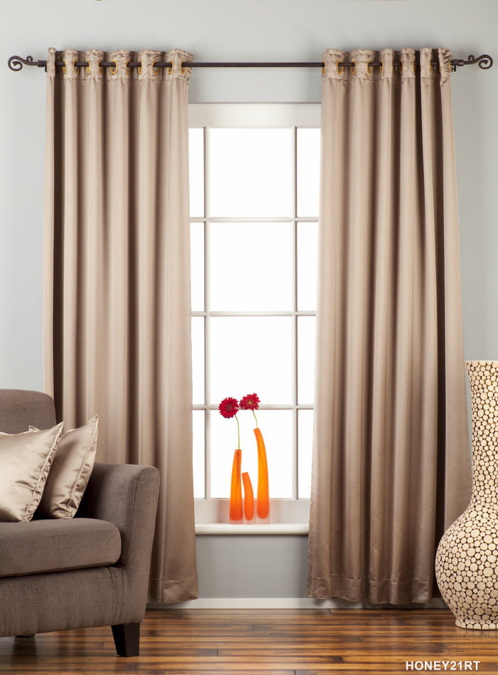Gray sari grommet top curtains hung at a window