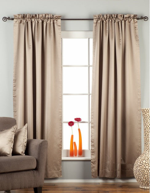 Gray sari rod pocket curtains hung at a window