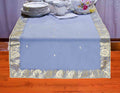 Gray silk table runner running down a dining table