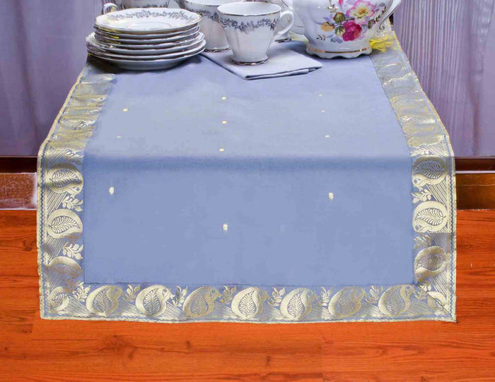 Gray silk table runner running down a dining table