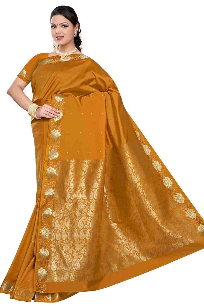 Mustard art silk sari shown draped on a model