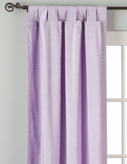Lavender velvet tab top curtains hung at a window