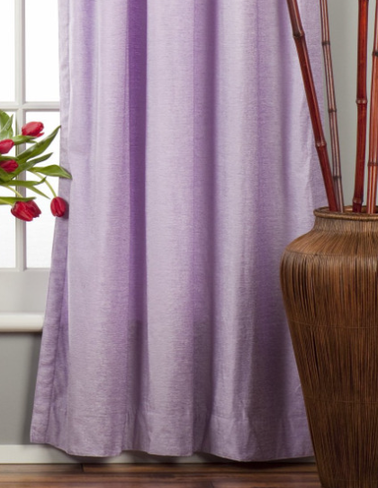 Lavender velvet tab top curtains hung at a window