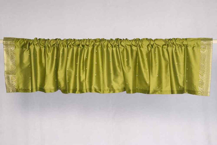 Olive green sari valance mounted above a window