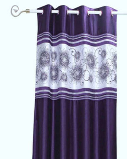 Purple sari grommet top curtains hung at a window