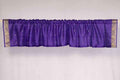 Purple sari valance mounted above a window