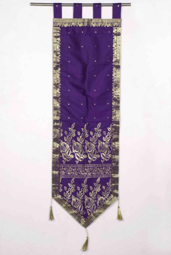 Purple sari wall hanging displayed on a wall