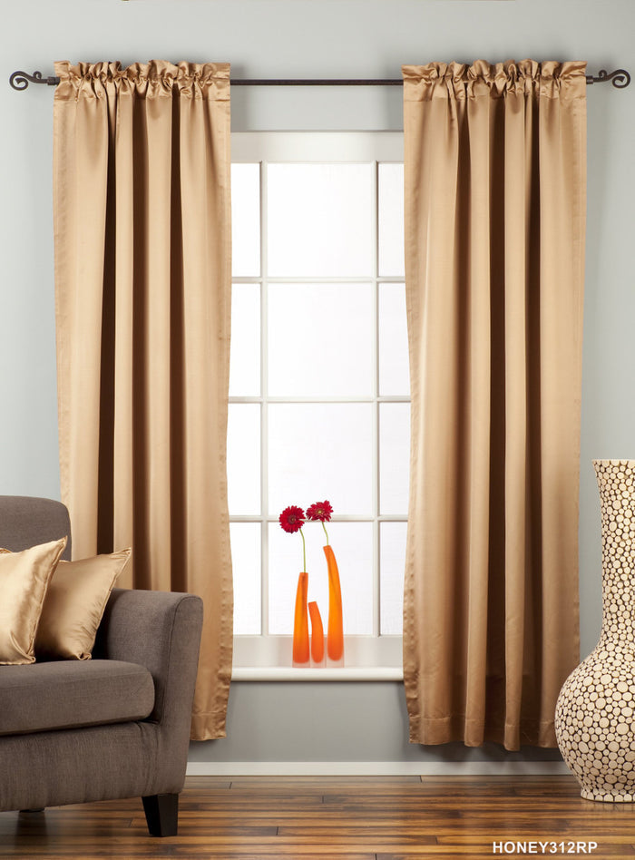 Taupe sari rod pocket curtains hung at a window