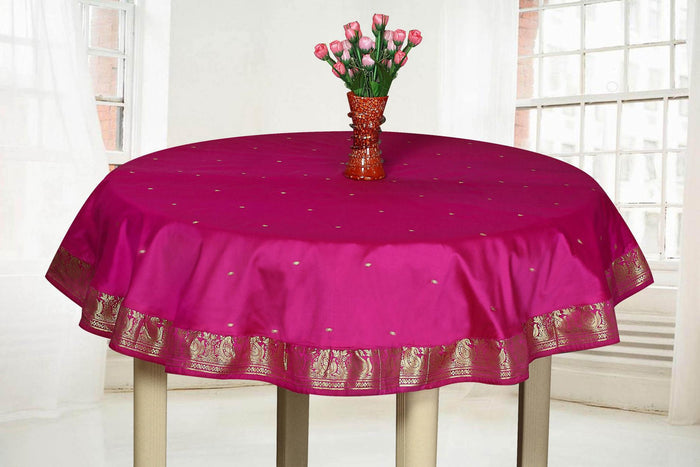 Violet sari tablecloth laid on a dining table