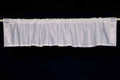 Silver sari valance mounted above a window